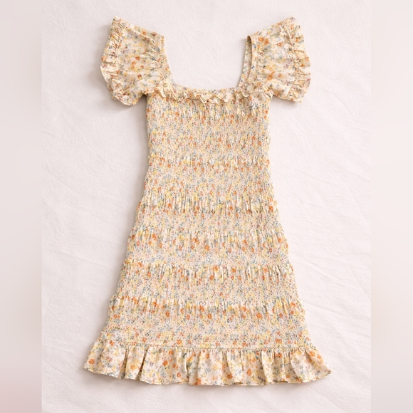 Storia Dresses & Skirts - Storia Yellow Floral Smocked Mini Dress with Orange Accents, Women's Size Medium